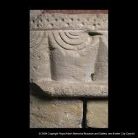 A detail of a scalloped Norman capital