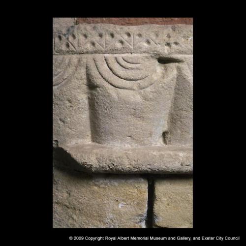 A detail of a scalloped Norman capital
