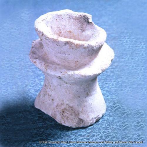 A Norman stone lamp
