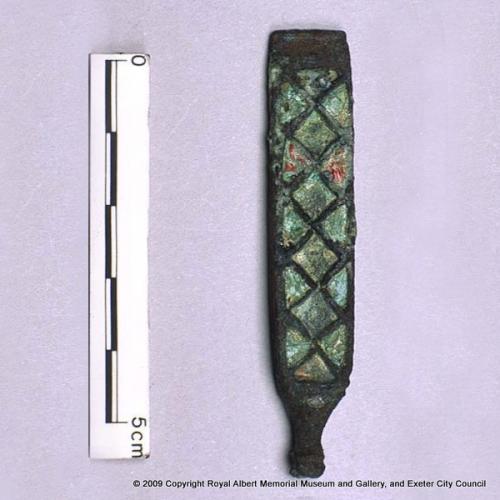 An  enamelled strap–end
