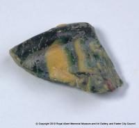 Fragment of multi–coloured glass