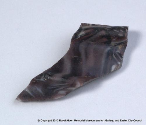 Fragment of multi–coloured glass