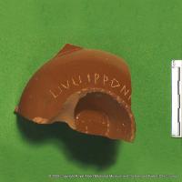 Sherd of a samian cup with engraving