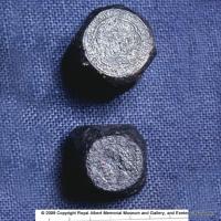 Two iron coin dies used to forge gold coins