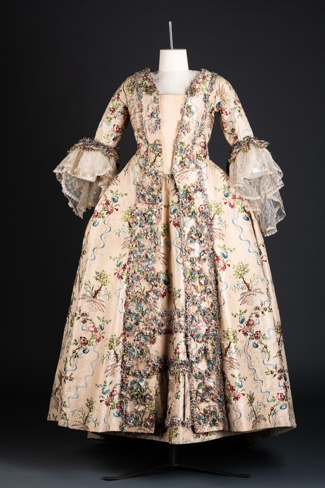 This beautiful gown must have been a real favourite with its owner.